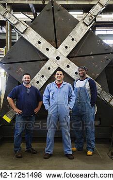 Stock Photo - three employees 
in factory. fotosearch 
- search stock 
photos, pictures, 
images, and photo 
clipart