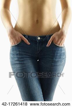 Stock Photo - woman wearing 
skinny jeans. 
fotosearch - search 
stock photos, 
pictures, images, 
and photo clipart