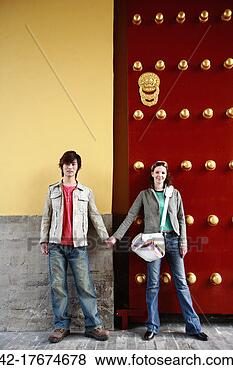 Stock Photo - young couple in 
front of ornate 
door. fotosearch 
- search stock 
photos, pictures, 
images, and photo 
clipart