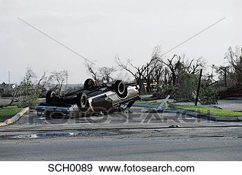 Stock Photograph - overturned car 
after hurricane 
andrew. fotosearch 
- search stock 
photos, pictures, 
images, and photo 
clipart