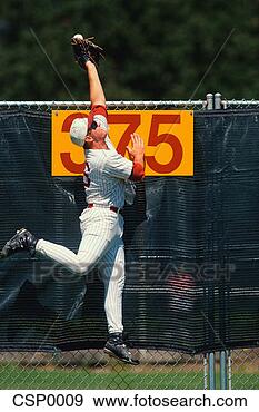 Stock Photograph - outfielder leaping 
to catch baseball. 
fotosearch - search 
stock photos, 
pictures, images, 
and photo clipart