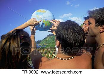 Stock Photo - friends finding 
their location 
on globe. fotosearch 
- search stock 
photos, pictures, 
images, and photo 
clipart