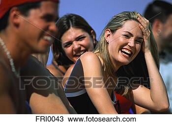 Stock Photo - laughing friends 
at dock. fotosearch 
- search stock 
photos, pictures, 
images, and photo 
clipart