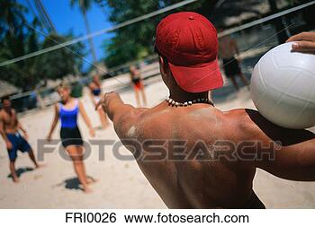 Stock Photo - young man holding 
volleyball. fotosearch 
- search stock 
photos, pictures, 
images, and photo 
clipart