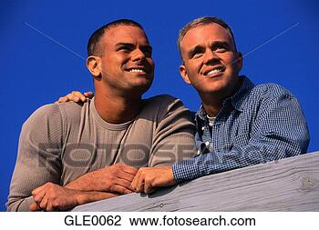 Stock Photo - gay couple leaning 
on a railing. 
fotosearch - search 
stock photos, 
pictures, images, 
and photo clipart