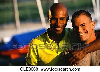 Stock Photo - gay couple posing 
together. fotosearch 
- search stock 
photos, pictures, 
images, and photo 
clipart