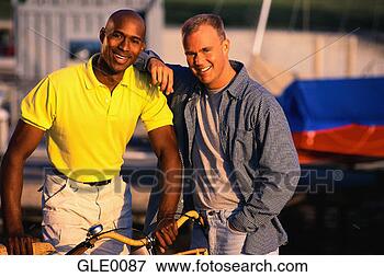 Picture - gay couple posing 
together. fotosearch 
- search stock 
photos, pictures, 
images, and photo 
clipart
