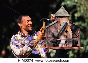 Stock Photo - building a birdhouse. 
fotosearch - search 
stock photos, 
pictures, images, 
and photo clipart