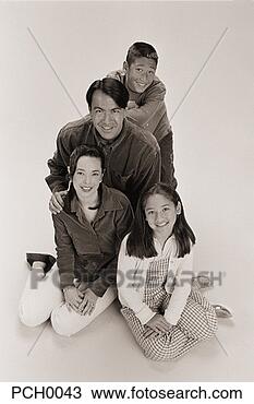 Stock Photo - family posing 
for a studio portrait. 
fotosearch - search 
stock photos, 
pictures, images, 
and photo clipart