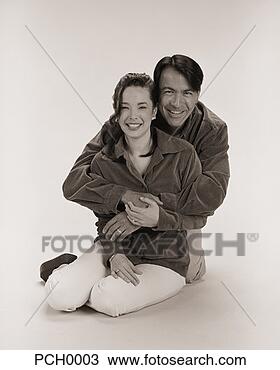 Stock Photo - studio portrait 
of a happy couple. 
fotosearch - search 
stock photos, 
pictures, images, 
and photo clipart