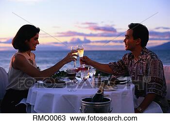 Stock Photo - couple toasting 
over an intimate 
dinner. fotosearch 
- search stock 
photos, pictures, 
images, and photo 
clipart