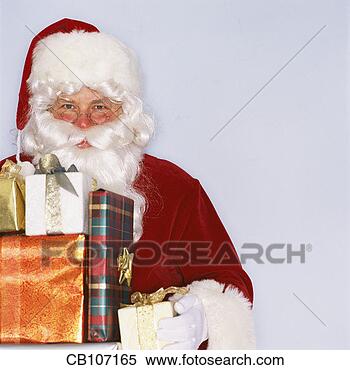 Stock Image - santa claus holding 
wrapped presents. 
fotosearch - search 
stock photos, 
pictures, images, 
and photo clipart