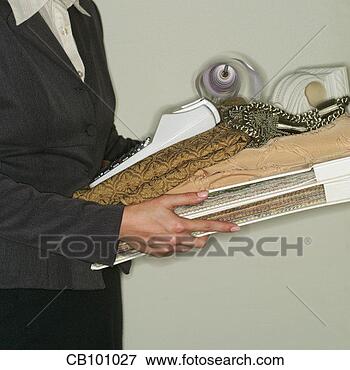 Picture - interior decorator 
carrying items. 
fotosearch - search 
stock photos, 
pictures, images, 
and photo clipart