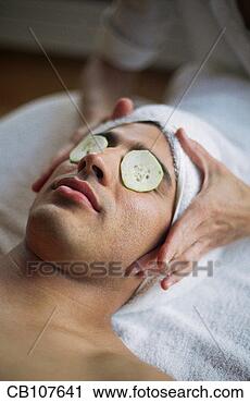 Stock Photography - woman preparing 
to give man facial 
at spa. fotosearch 
- search stock 
photos, pictures, 
images, and photo 
clipart