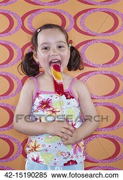 Stock Image - girl eating lollipop. 
fotosearch - search 
stock photos, 
pictures, images, 
and photo clipart