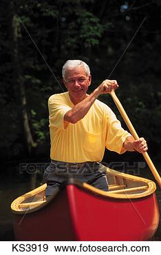 Stock Photograph - lifestyles - age 
50s & 60s, boat, 
boating, canoe, 
canoeing, exercising. 
fotosearch - search 
stock photos, 
pictures, images, 
and photo clipart