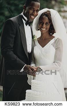 Stock Photo - wedding day, african 
american, bride, 
cake, celebration, 
ceremony. fotosearch 
- search stock 
photos, pictures, 
images, and photo 
clipart