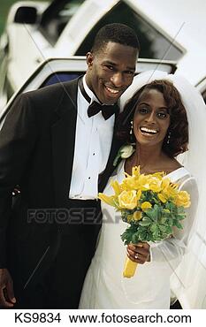Stock Photo - wedding day,  
african american, 
 bouquet,  boutonniere, 
 bride. fotosearch 
- search stock 
photos, pictures, 
images, and photo 
clipart