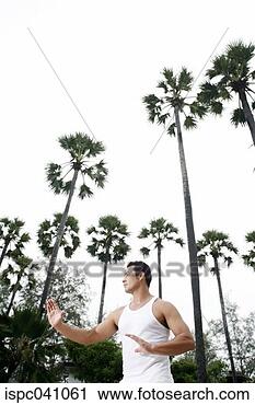 Stock Photography - man practicing 
tai chi. fotosearch 
- search stock 
photos, pictures, 
images, and photo 
clipart
