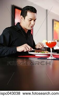 Stock Photo - man enjoying his 
meal in a restaurant. 
fotosearch - search 
stock photos, 
pictures, images, 
and photo clipart