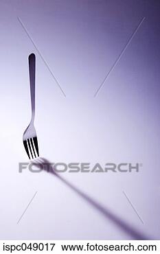 Picture - a standing fork 
and its shadow. 
fotosearch - search 
stock photos, 
pictures, images, 
and photo clipart