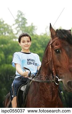 Picture - boy riding a horse. 
fotosearch - search 
stock photos, 
pictures, images, 
and photo clipart
