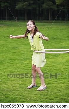 Stock Photo - girl playing the 
hula hoop. fotosearch 
- search stock 
photos, pictures, 
images, and photo 
clipart
