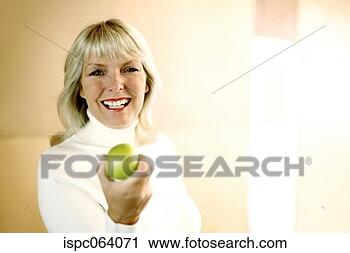 Stock Photography - woman holding 
a green apple. 
fotosearch - search 
stock photos, 
pictures, images, 
and photo clipart