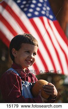 Stock Photograph - boy with pumpkin 
and american flag. 
fotosearch - search 
stock photos, 
pictures, images, 
and photo clipart