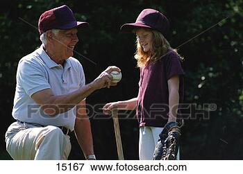 Picture - grandfather teaching 
granddaughter 
baseball. fotosearch 
- search stock 
photos, pictures, 
images, and photo 
clipart