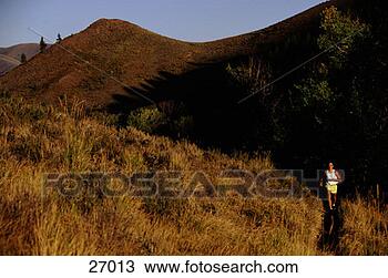 Stock Photo - man running paths 
near hills. fotosearch 
- search stock 
photos, pictures, 
images, and photo 
clipart