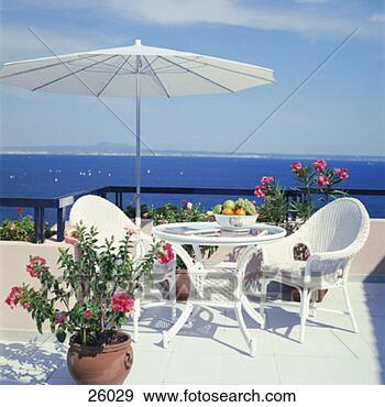 Stock Photograph - patio furniture 
and umbrella. 
fotosearch - search 
stock photos, 
pictures, images, 
and photo clipart