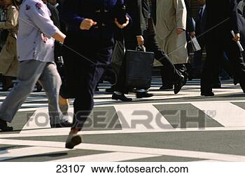 Picture - person running 
across a shinjuku 
intersection. 
fotosearch - search 
stock photos, 
pictures, images, 
and photo clipart