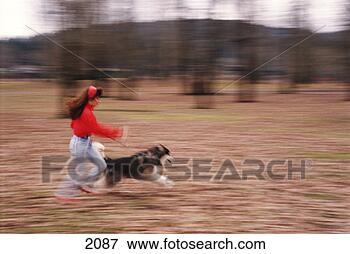Picture - woman running 
with her dog. 
fotosearch - search 
stock photos, 
pictures, images, 
and photo clipart