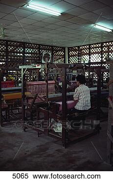 Stock Image - woman weaving 
silk fabric. fotosearch 
- search stock 
photos, pictures, 
images, and photo 
clipart