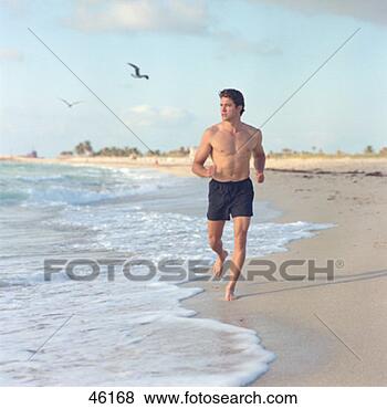 Stock Photo - man running on 
the beach. fotosearch 
- search stock 
photos, pictures, 
images, and photo 
clipart
