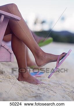 Stock Photo - woman wearing 
thongs at the 
beach. fotosearch 
- search stock 
photos, pictures, 
images, and photo 
clipart