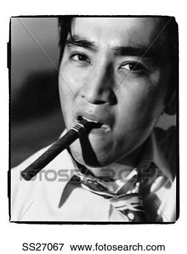 Picture - businessman smoking 
cigar. fotosearch 
- search stock 
photos, pictures, 
images, and photo 
clipart