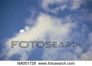 Stock Photograph - moon from behind 
clouds. fotosearch 
- search stock 
photos, pictures, 
images, and photo 
clipart