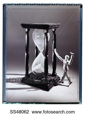 Stock Photo - artist's figure 
and an hourglass. 
fotosearch - search 
stock photos, 
pictures, images, 
and photo clipart