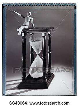 Stock Photo - artist's figure 
sitting on an 
hourglass. fotosearch 
- search stock 
photos, pictures, 
images, and photo 
clipart
