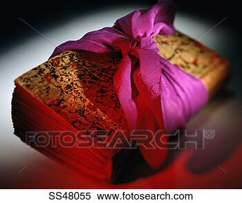 Stock Image - book tied with 
a piece of fabric. 
fotosearch - search 
stock photos, 
pictures, images, 
and photo clipart