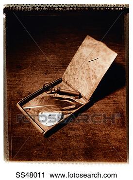 Stock Photography - key, feather and 
a clock face in 
an old metal box. 
fotosearch - search 
stock photos, 
pictures, images, 
and photo clipart