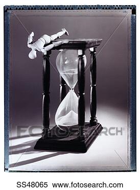 Stock Image - lay figure on 
top of an hourglass. 
fotosearch - search 
stock photos, 
pictures, images, 
and photo clipart