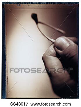 Picture - man's hand holding 
a wishbone. fotosearch 
- search stock 
photos, pictures, 
images, and photo 
clipart