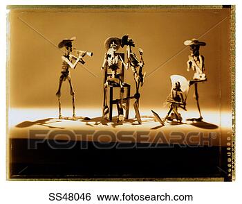 Stock Photo - mexican skeleton 
figurines playing 
instruments. fotosearch 
- search stock 
photos, pictures, 
images, and photo 
clipart