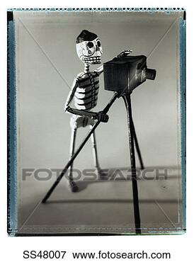 Picture - photographer skeleton 
figurine. fotosearch 
- search stock 
photos, pictures, 
images, and photo 
clipart