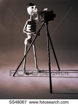 Picture - photographer skeleton 
figurine. fotosearch 
- search stock 
photos, pictures, 
images, and photo 
clipart