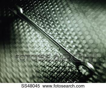 Stock Image - spanner on a metal 
screen. fotosearch 
- search stock 
photos, pictures, 
images, and photo 
clipart