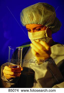 Stock Photo - chemist measuring 
liquid into a 
beaker. fotosearch 
- search stock 
photos, pictures, 
images, and photo 
clipart